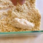 artichoke being breaded