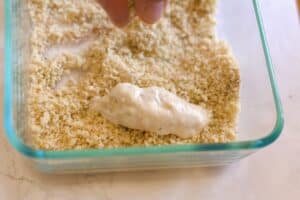 artichoke being breaded
