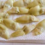 artichokes drying on paper towels