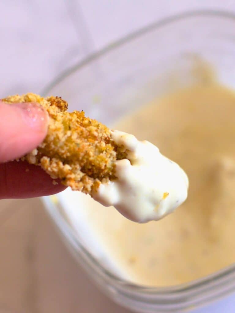 yogurt sauce on an air fried artichoke