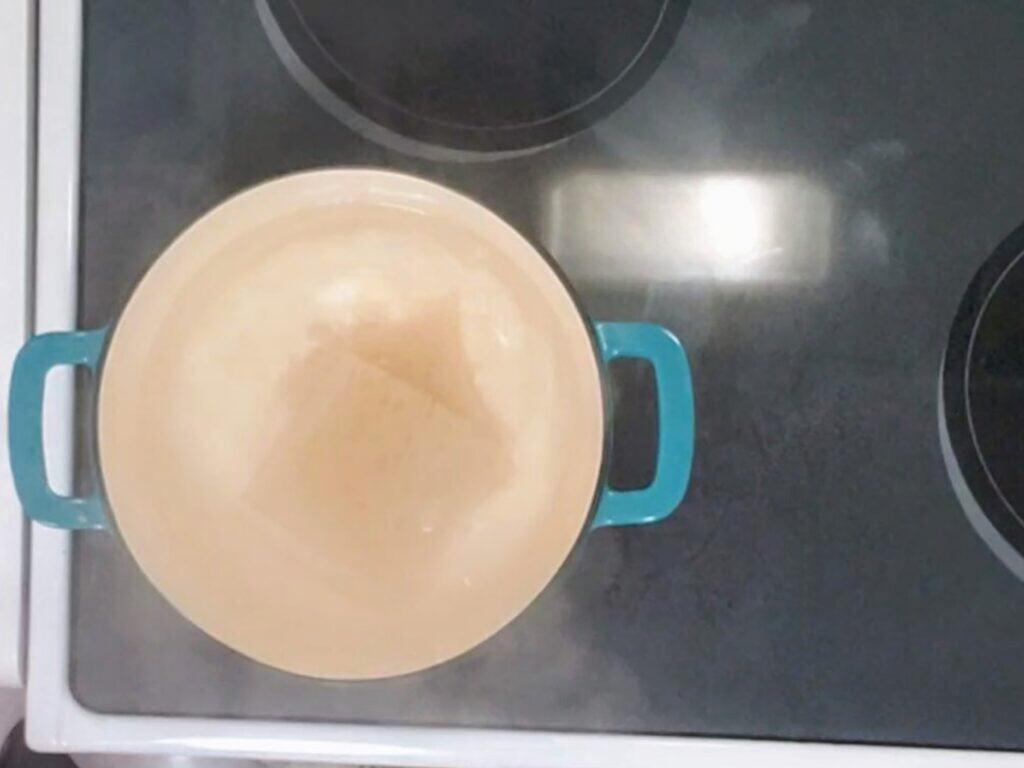 ramen noodles boiling in a pot