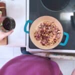 black bean sauce added to a pot of onions
