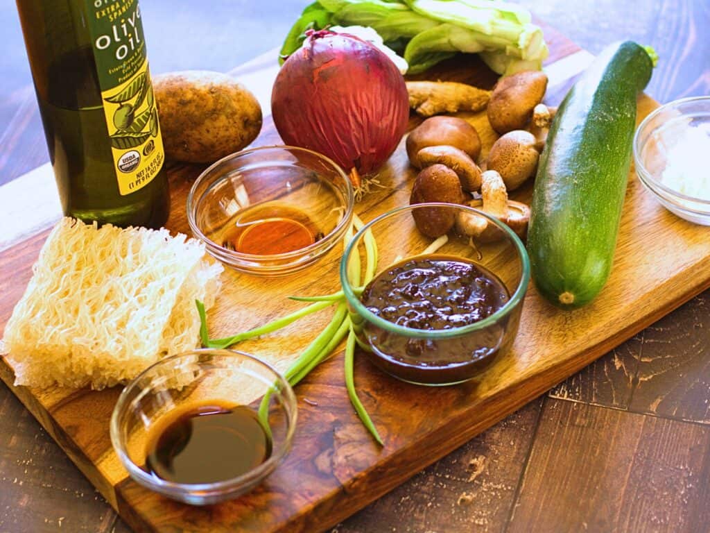 ingredients for black bean ramen on a cutting board