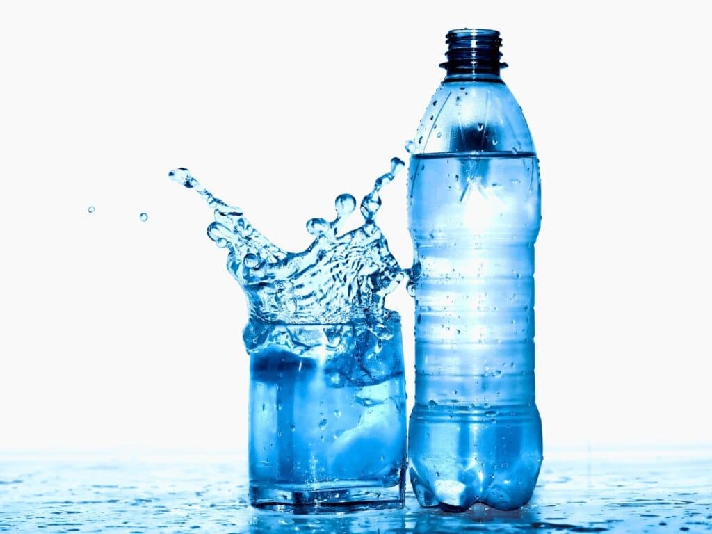 a bottle and glass of water