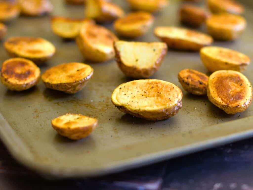 roasted mini potatoes on a baking sheet
