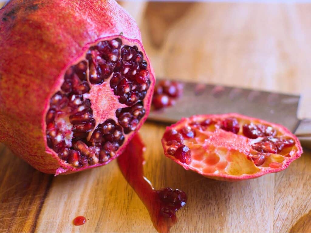 a pomegranate with the end sliced off