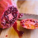 a pomegranate with the end sliced off