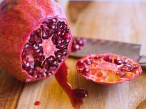 a pomegranate with the end sliced off