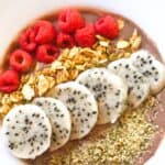 smoothie bowl with dragon fruit, raspberries, and granola
