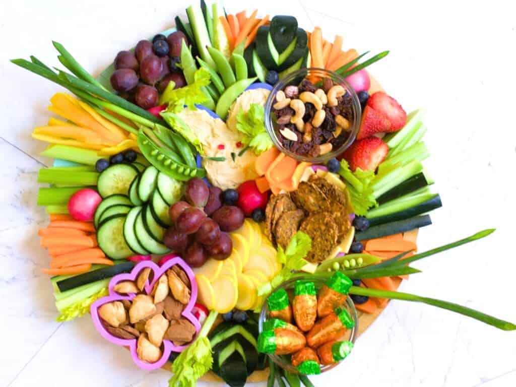 easter charcuterie board with hummus shaped like a rabbit