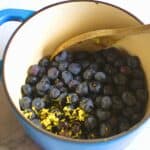 blueberries and lemon zest in a saucepan