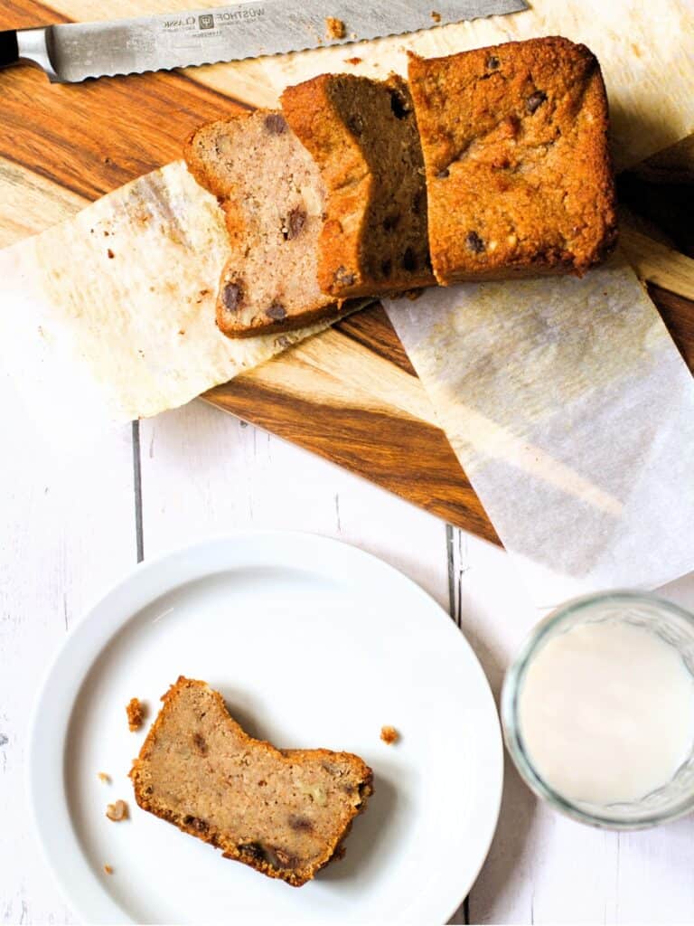 a loaf of keto banana bread and a slice on a plate