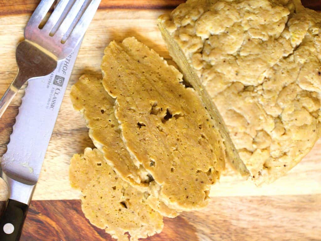 slices of seitan on a cutting board
