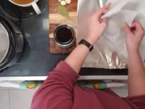 seitan wrapped in parchment paper and aluminum foil