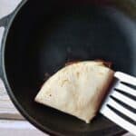 a wrap being heated in a skillet