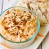 carrot cake dairy free dip in a glass dish with cinnamon tortilla chips