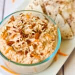 carrot cake dairy free dip in a glass dish with cinnamon tortilla chips