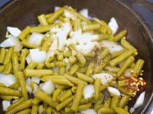 canned green beans in a skillet