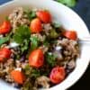 arroz moros in a bowl with pico de gallo