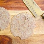 low carb tortillas on a cutting board with a knife