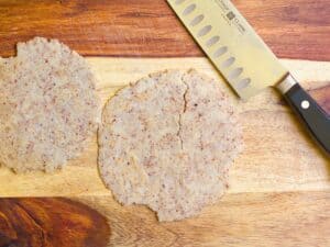 low carb tortillas on a cutting board with a knife