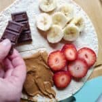 chocolate being added to a dessert wrap