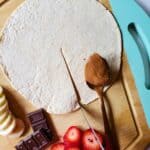 a tortilla being sliced