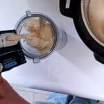 tofu and soy milk being poured into a blender