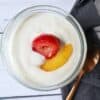 plant based yogurt in a glass dish with fruit