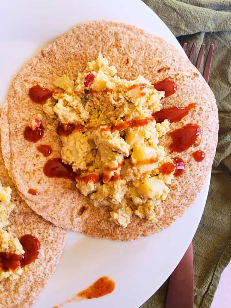 breakfast burrito with hot sauce