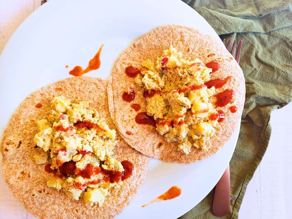 plant based breakfast casserole on top of whole wheat tortillas