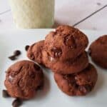 eggless cookies on a plate with a glass of soymilk